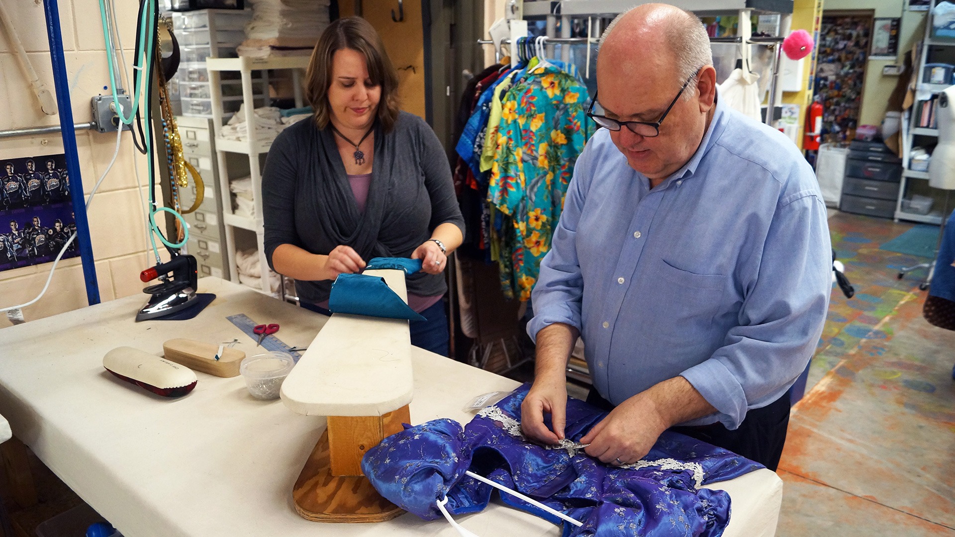 Costume Designer Howard Vincent Kurtz working on a dress